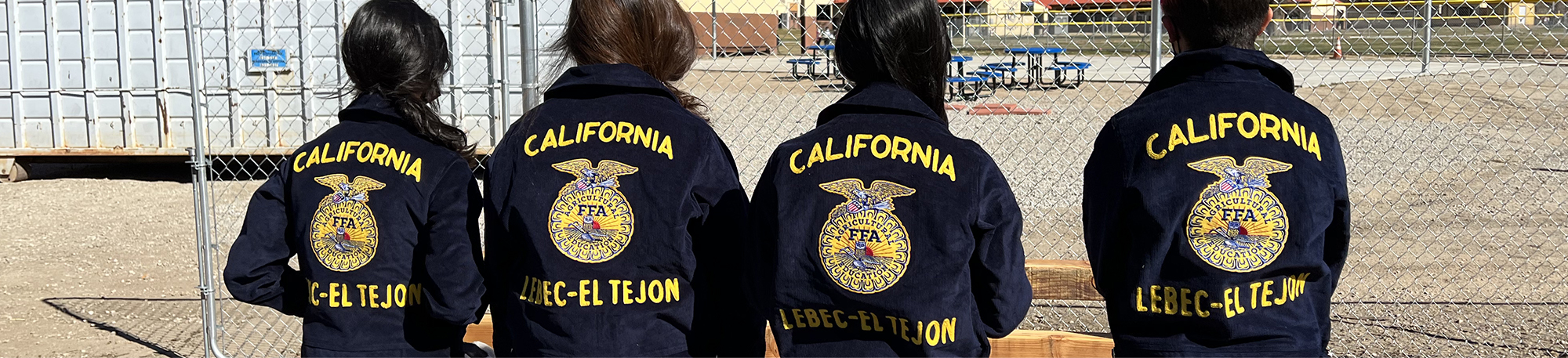Four students in FFA jackets